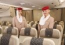 Emirates flight attendants show off the airline's new A380 Premium Economy cabin