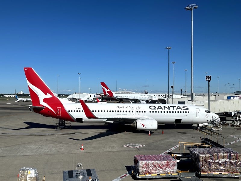 Qantas Boeing 737 and Airbus A330 jets at Brisbane Airport domestic terminal