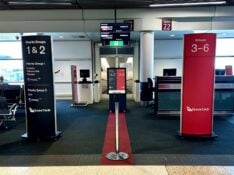 Qantas boarding group signage at a gate at Brisbane Airport
