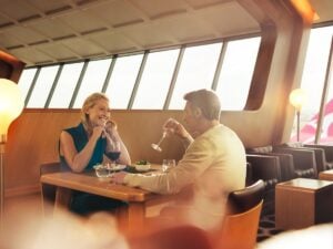 Couple dining in the Qantas First Lounge in Sydney