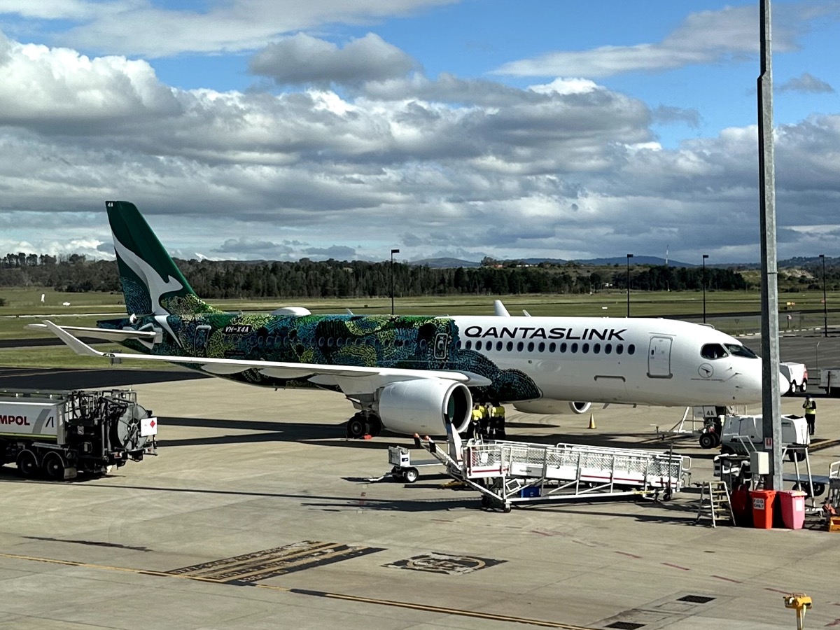 QantasLink's first Airbus A220-300 in green livery at Canberra Airport