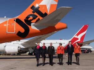 Jetstar A321neo and Qantas 787 aircraft tails with Qantas and Jetstar cabin crew