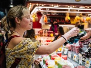 Woman paying at a bazaar with credit card