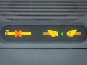 No-smoking and seatbelt signs on a plane
