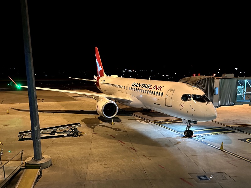 QantasLink A220 at Canberra Airport in regular livery