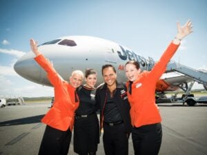 Jetstar cabin crew in front of a Dreamliner