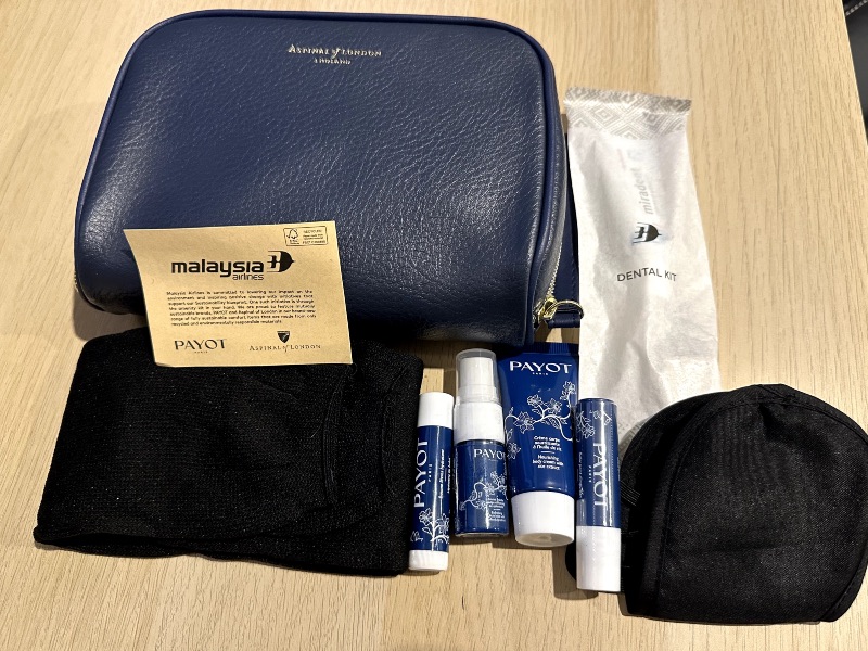 The Malaysia Airlines Business Class amenity kit contains an eye shade, socks, toothbrush, toothpaste and various Payot creams and sprays