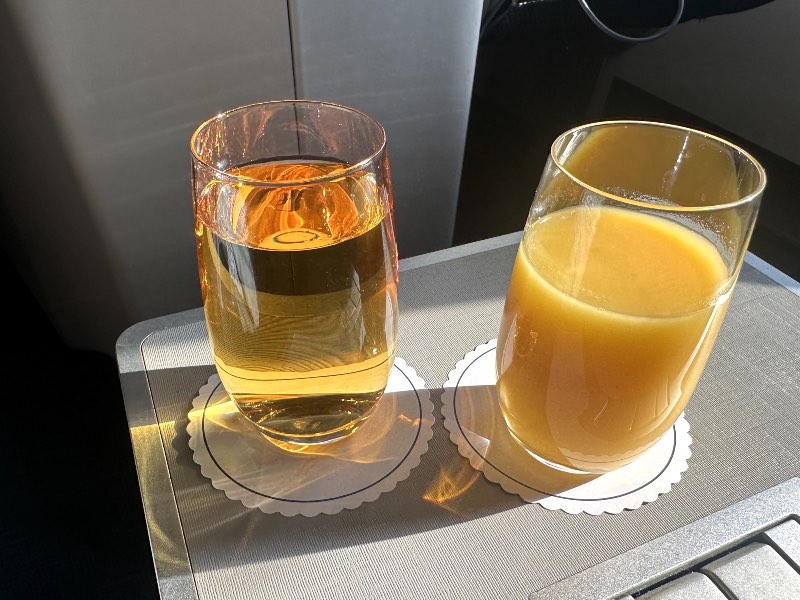 Pre-departure apple and orange juice in Malaysia Airlines business class