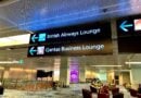 Sign pointing to the British Airways Lounge and Qantas Business Lounge at Singapore Changi airport