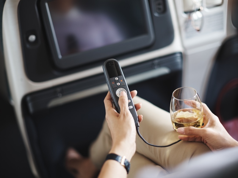 Drinking wine and watching TV in Cathay Pacific regional Business Class