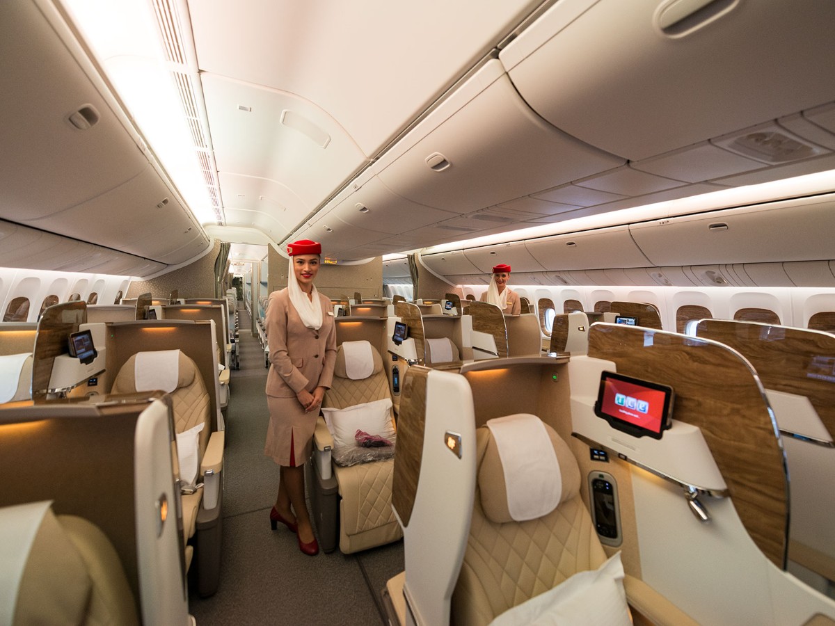 Emirates Boeing 777-300ER Business Class with cabin crew.