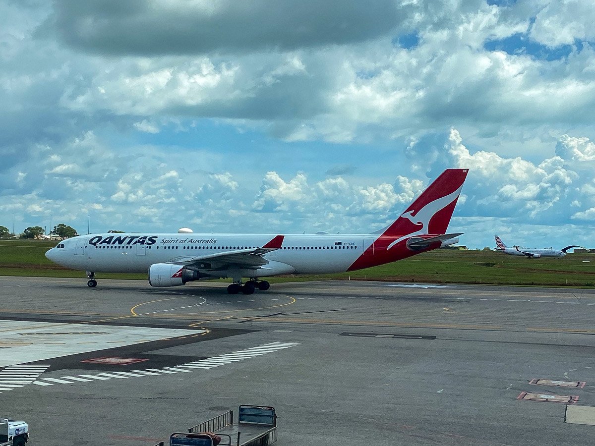 A Qantas Airbus A330-200 in front of a Virgin Australia Boeing 737-800 at Darwin Airport