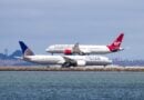 San Francisco / CA / USA - Virgin Atlantic aircraft landing at San Francisco Airport while an United Airlines aircraft is waiting to take off