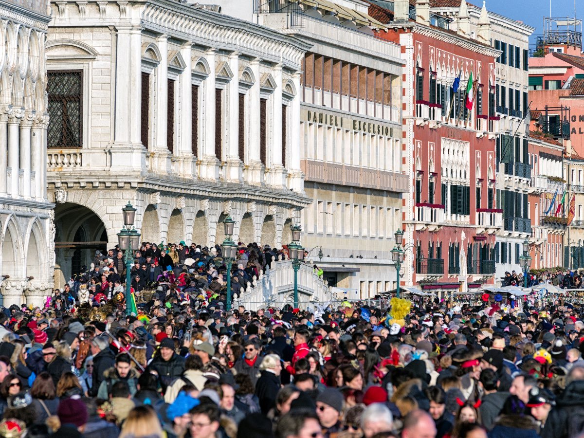 VENICE, ITALY - FEBRUARY 11: Overcrowded waterfront Riva degli Schiavoni on February 11, 2018 in Venice