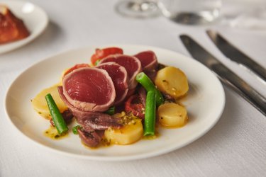 Fresh tuna Nicoise salad with olives, green beans, and lemon dressing.jpg