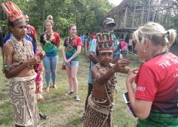 108 - Receiving welcome lai's from young meri's.jpg